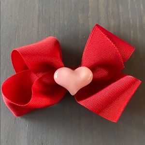Large red bow with pink glitter heart. Brand new.